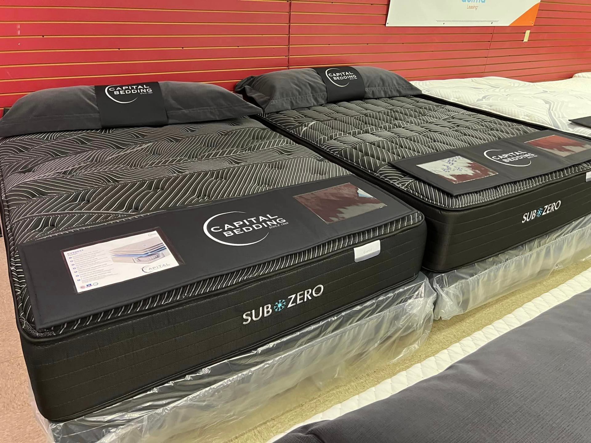 Metro Mattress & Furniture showroom with mattresses and sectionals