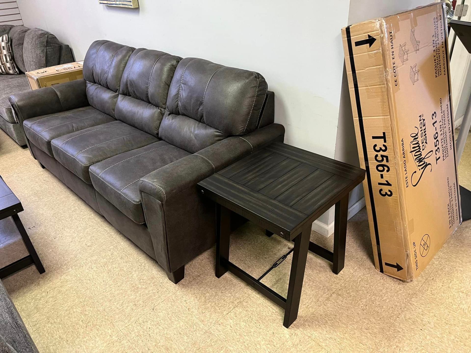 Ashley leather-look sofa with end table